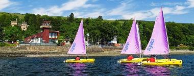 Sailing boats on the water at Blairvadach Outdoor Education Centre