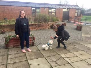 Kara giving Charlie the dog a high five