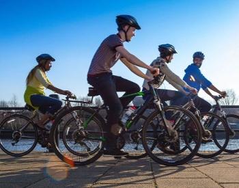 Four people cycling